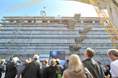 The 'Richtkrone' is lifted at the Richftfest roof-topping ceremony at ESOC