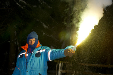 Andreas using a flare for survival training