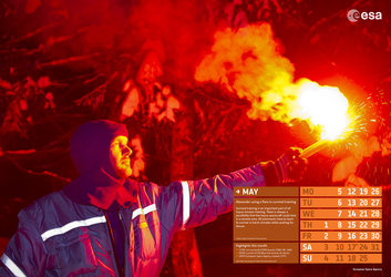 Alexander using a flare in survival training