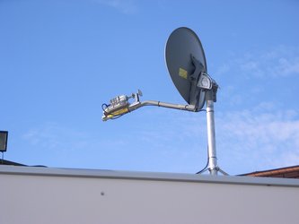 Self-pointing satellite dish on van