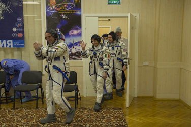 Expedition 42/43 crew members dressed in their Russian Sokol suit