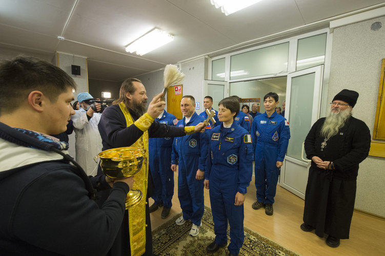 Expedition 42/43 crew members receive the traditional blessing