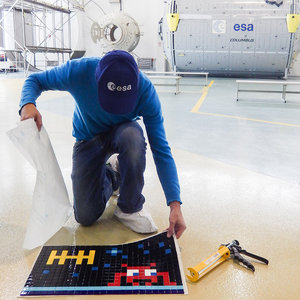 Invader installing art at ESA’s astronaut centre