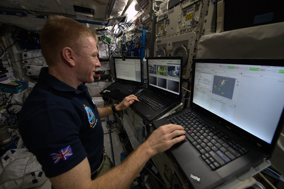 Tim Peake working in Space Station