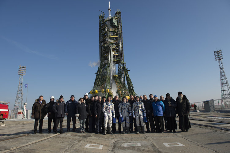 Soyuz TMA-19M crew members and dignitaries at the launch pad