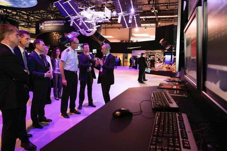 High-level visitors briefed on spacecraft operations at ILA, the Berlin airshow