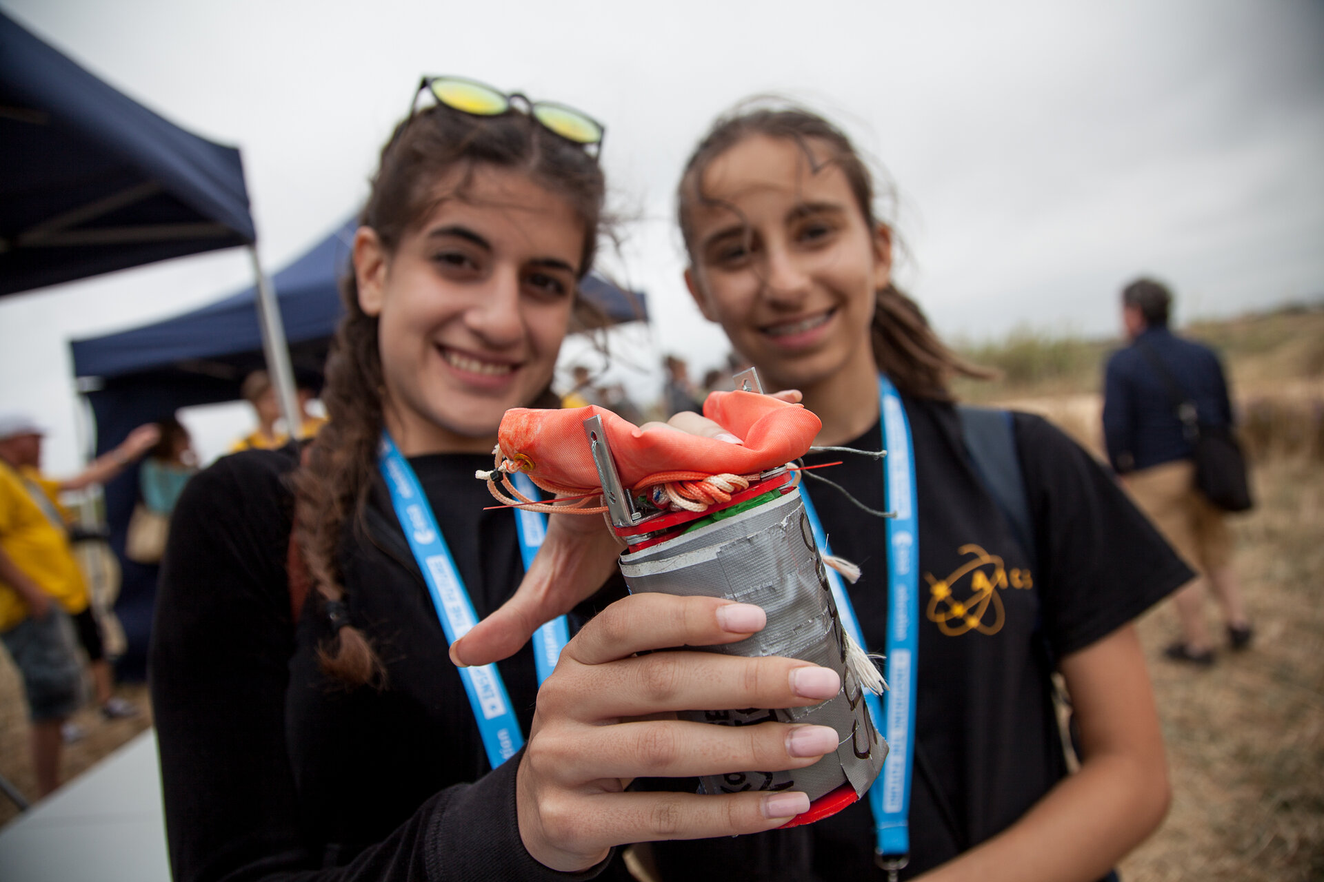 Students holding their CanSat at the 2016 CanSat launch campaign 