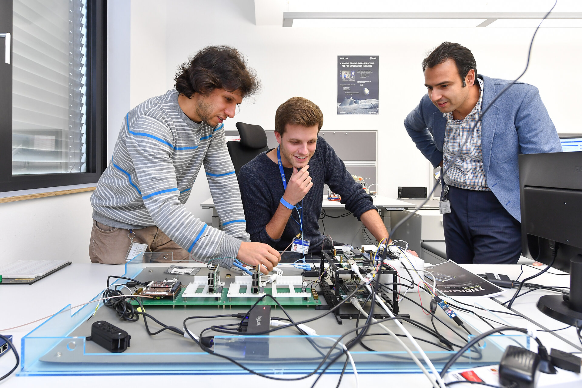 Mehran Sarkarati (right) and his colleagues working at ESOC's AGSA Lab