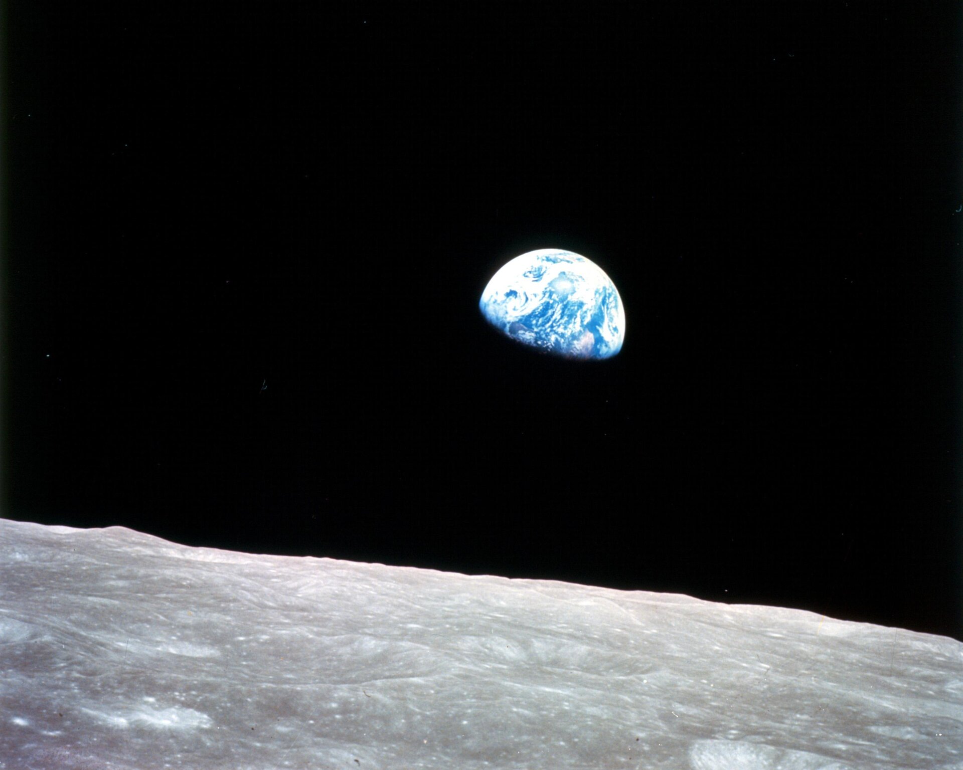 Iconic image of Earth rising above lunar surface