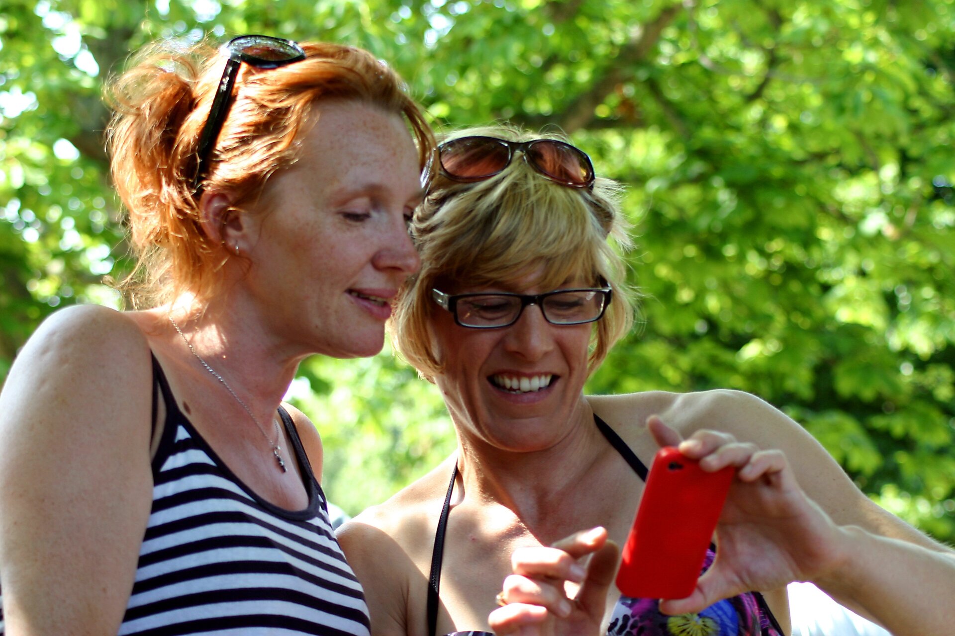 Women in summer clothes with phone