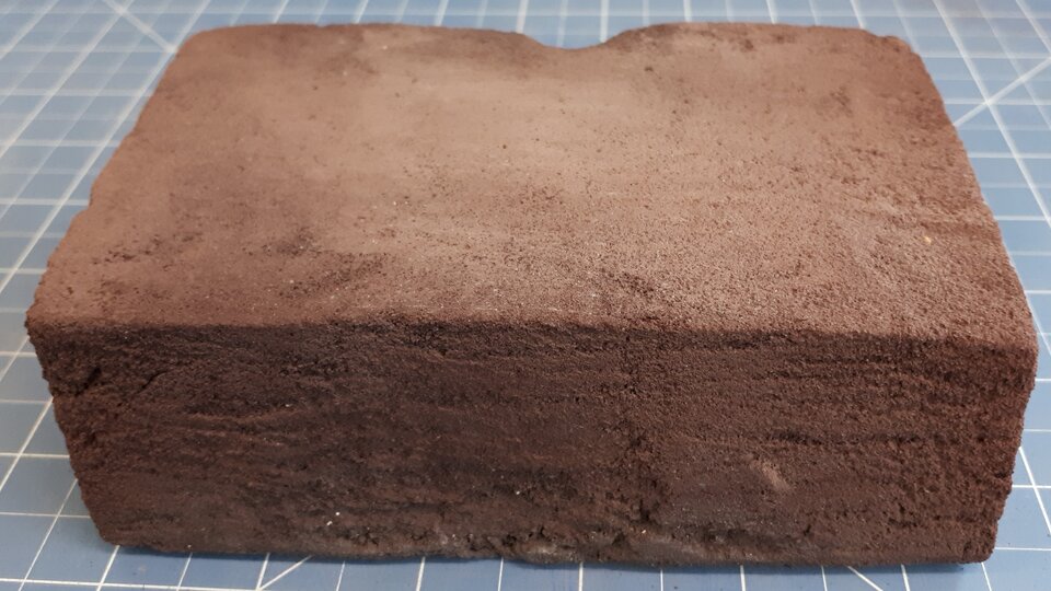 Homemade regolith brick, 14 cm long.