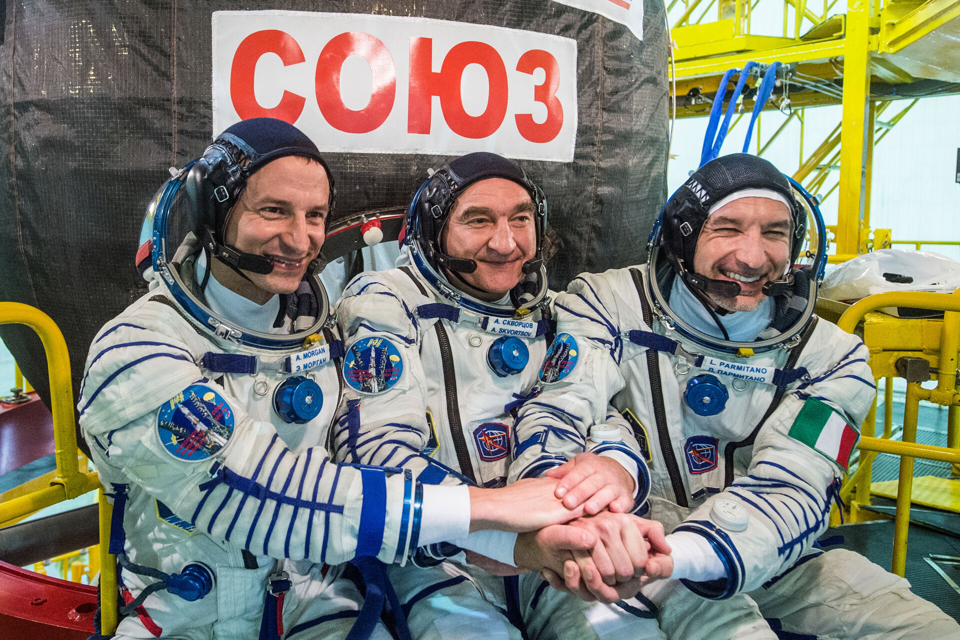 Luca Parmitano with his crew in front of their Soyuz spacecraft
