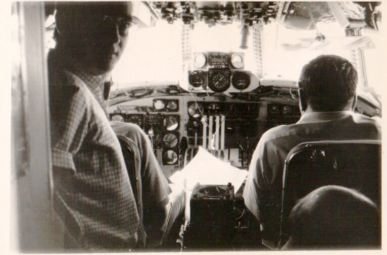 Valeriano Claros Guerra in cockpit of NASA test aircraft overflying Canary Island station during Apollo flights simulations.