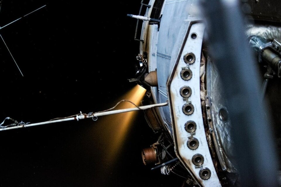 Zvezda burning its engines to adjust the Space Station's orbit