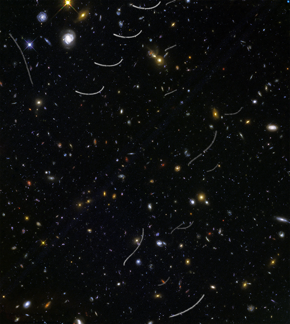 Hubble deep image of the Universe, photobombed by asteroids that left white trails on the image.