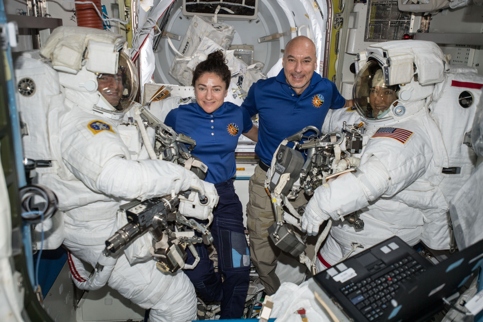 ESA astronaut Luca Parmitano assists spacewalkers in the Quest airlock