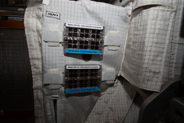 Two MatISS (Microbial Aerosol Tethering on Innovative Surfaces in the International Space Station) sample holders. The MATISS experiment investigates the antibacterial properties of various materials in space for possible application in future spacecraft. MATISS is expected to provide additional insight into the mechanisms of attachment of biofilms in microgravity conditions. 