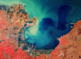 Copernicus Sentinel-2 takes us over the sediment-stained waters in Laizhou Bay, located on the southern shores of the Bohai Sea, on the east coast of mainland China.