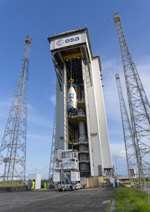 The crane hoists the fairing with stowed payloads to the top of the mobile gantry for integration with Vega