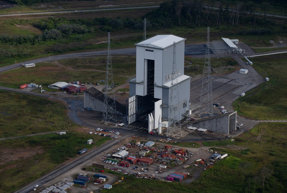 Mobile gantry over the launch pad; note the flame ports to right and left