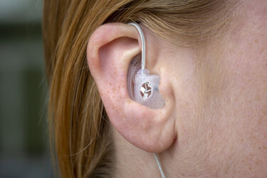 In-ear device for measuring brain activity