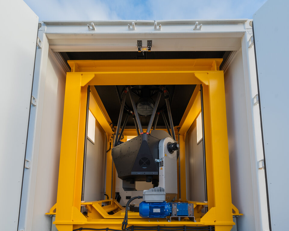 Deployable telescope within shipping container